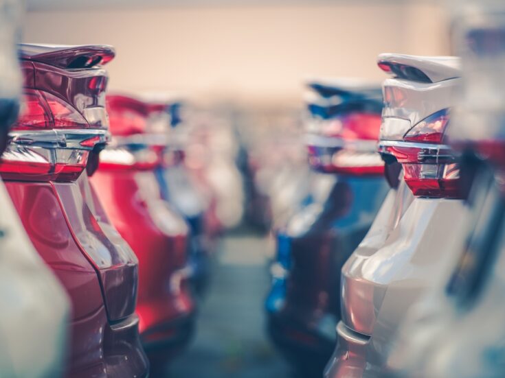 Cars lined up in a showroom -Aston Barclay has launched a fully closed group ‘white label’ timed auction platform to help finance houses repatriate used cars back into franchised dealer networks.